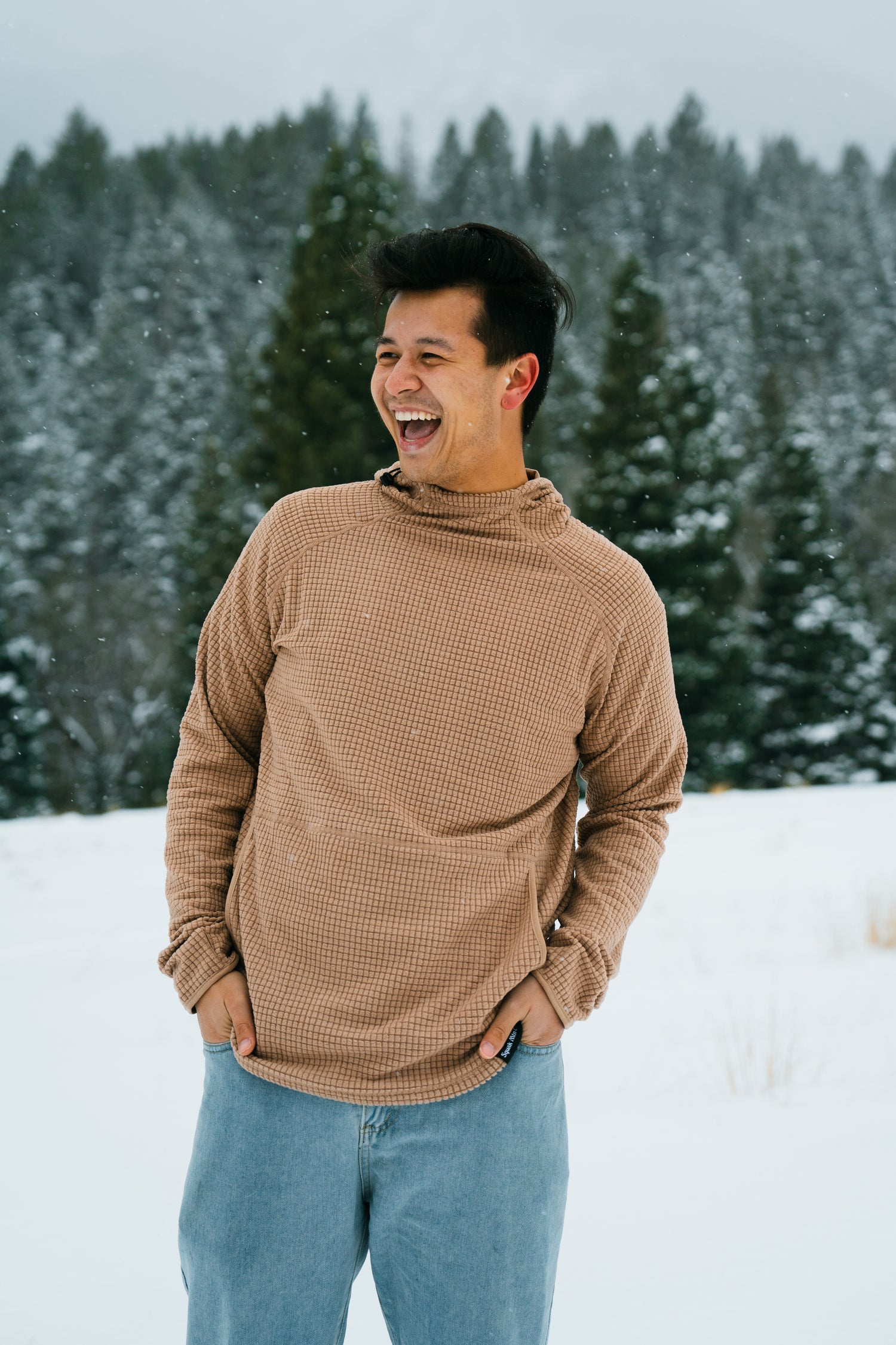 Happy man wearing micro grid fleece hoodie from Squak Mountain Co.