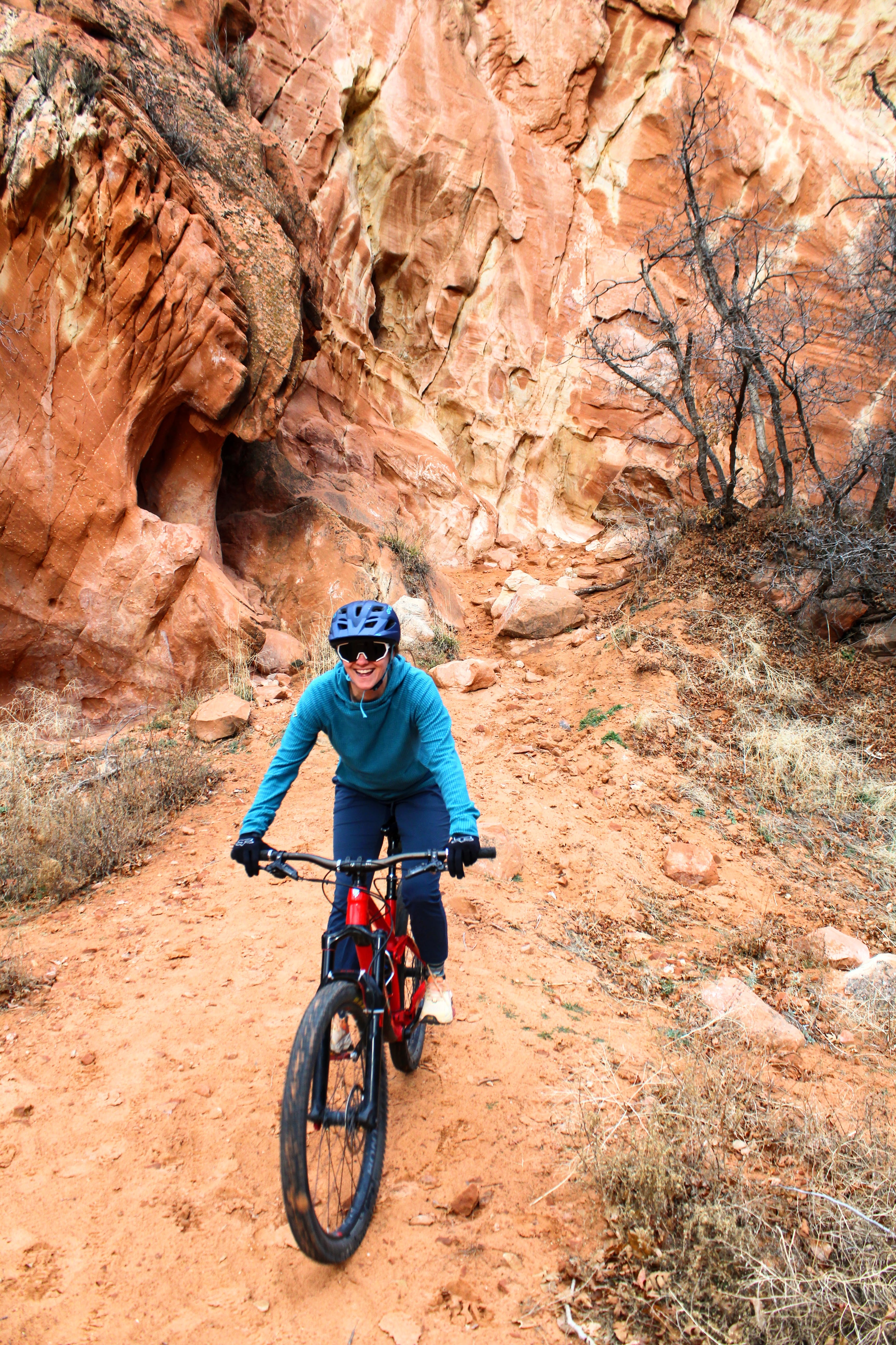 Person biking with micro grid fleece hoodie for outdoors from Squak Mountain Co.