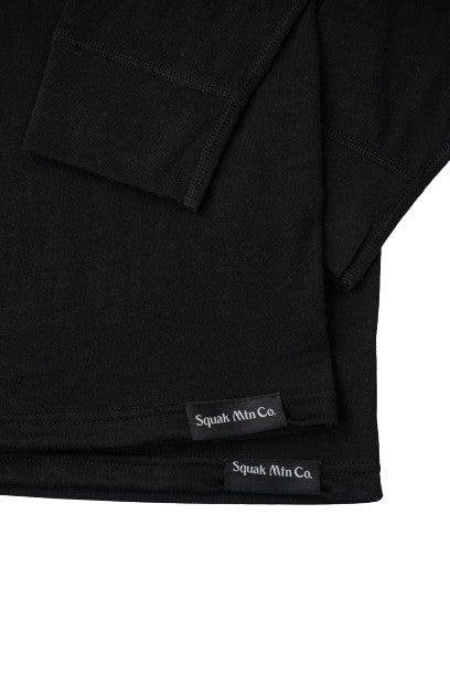 Logo on stacked black wool base layer hoodie from Squak Mountain Co.